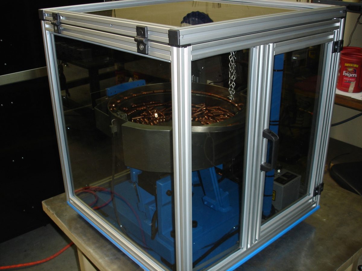 Extruded aluminum sound enclosure around a feeder