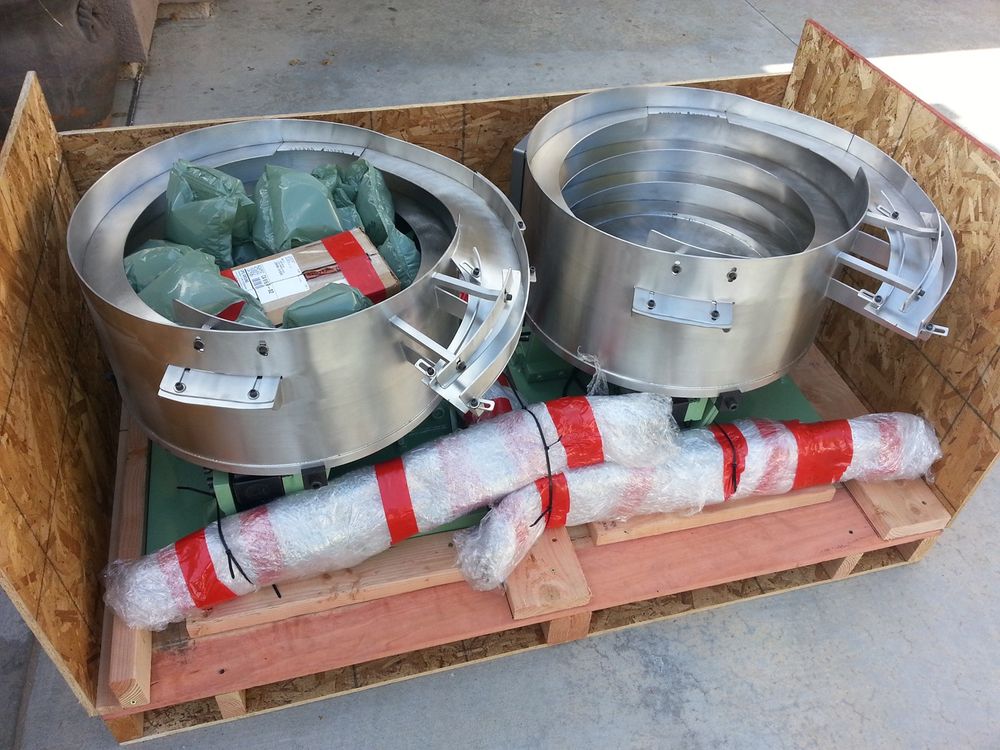 Two stainless bowls crated for shipping